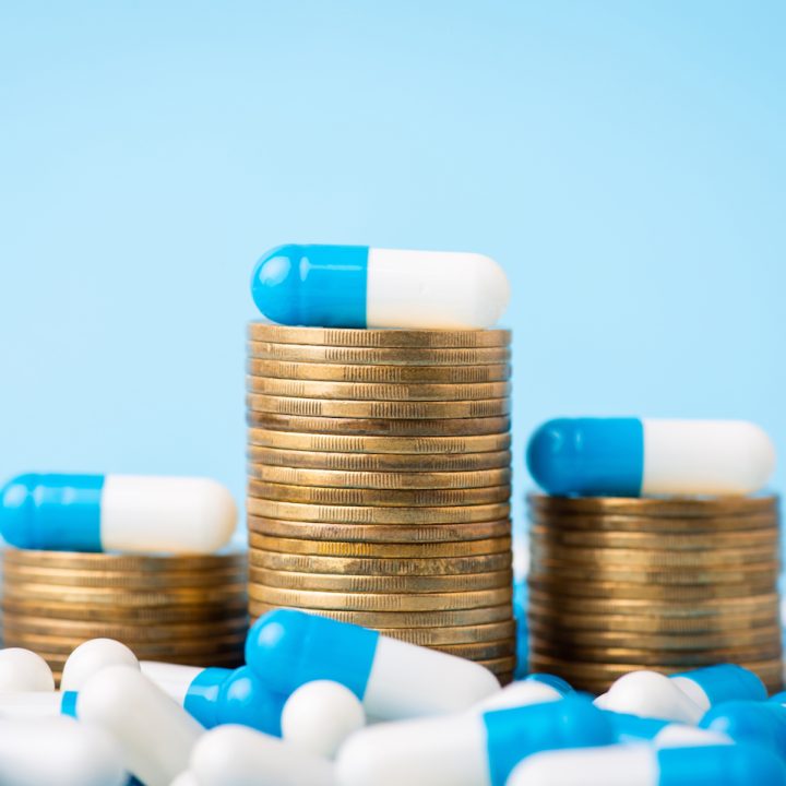 Stacks,Of,Coins,Between,Medical,Pills,Capsules.,Concept,Of,Expensive